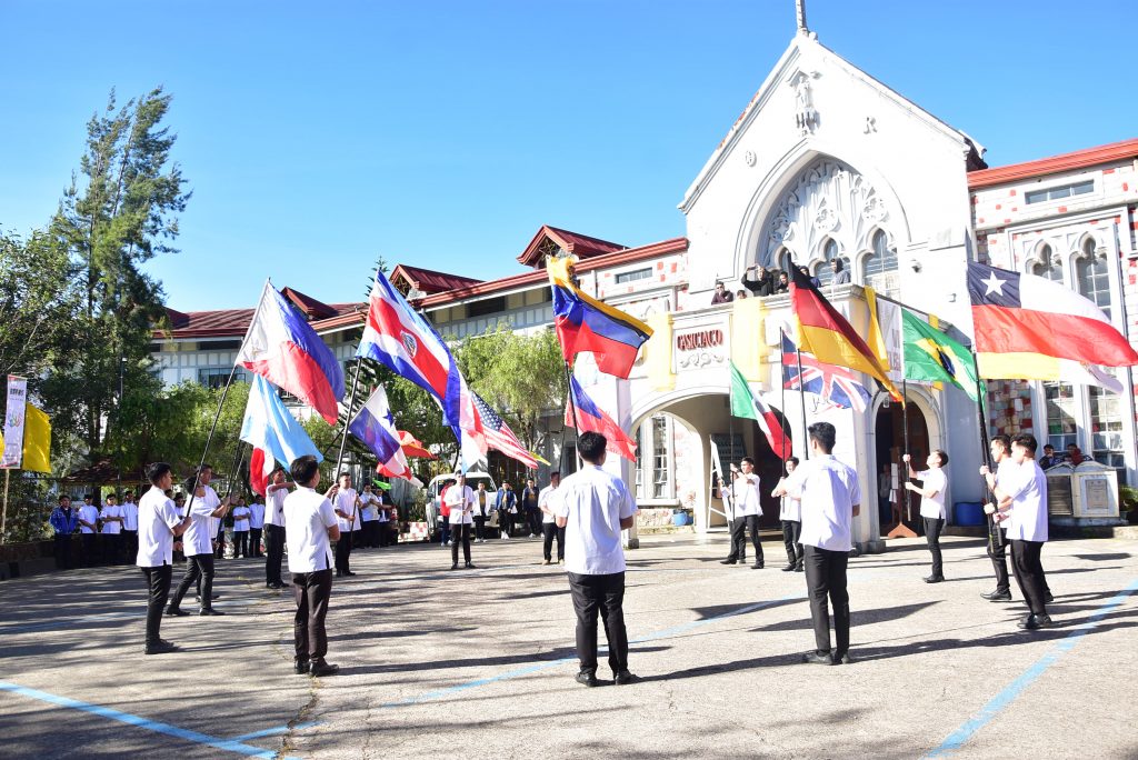 Seminarians parade the flags of 22 countries where the Order maintains missionary presence during the welcome program of the 13th RAYNS.