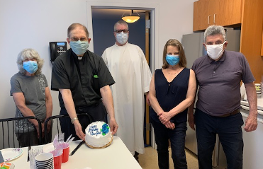  Undercover Birthday: Fr. John Gruben celebrates his birthday with some of the parish staff of Sacred  </br> Heart Church (l to r): Janis Batewell (director of Religious Ed), Fr. John, Fr. Michael Rafferty (pastor), </br> Patt Chester (parish secretary) and Henry Antonucci (sacristan)